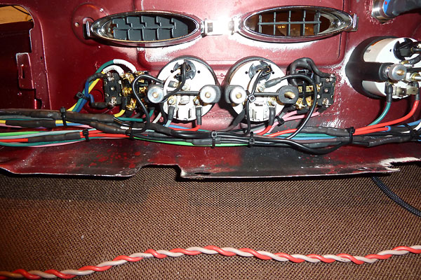 Close-up on switch and gauge wiring, and modifications made to the MGB Mk1 dashboard.