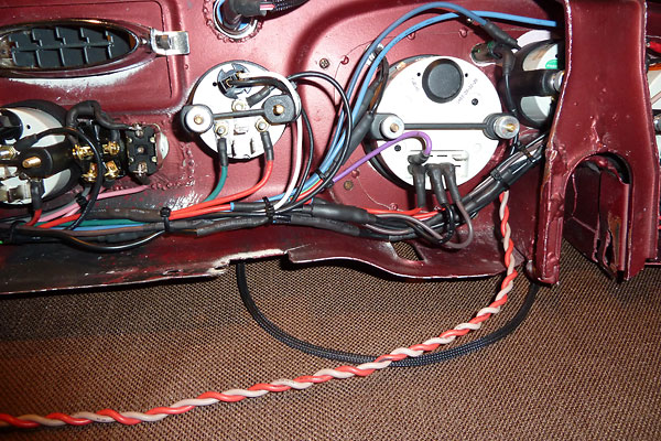 Close-up on speedometer gauge wiring and modifications made for the fitment of gauges.