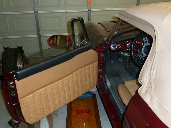 Re-upholstered MGB doors, with release levers, locks, and window winders (etc.) deleted.