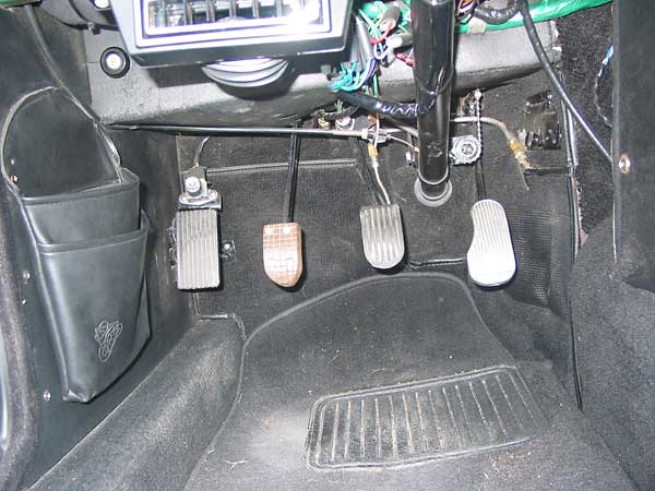 dead pedal, foot-operated high-beam switch, clutch pedal extension