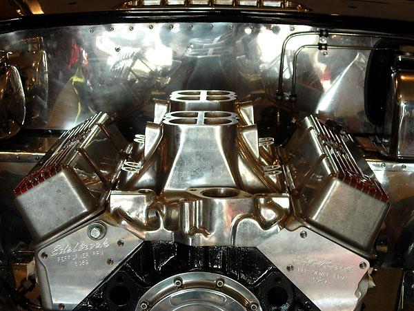Edelbrock Performer RPM aluminum cylinder heads, topped with Holley's Stealth Ram tunnel-ram style high rise manifold.
