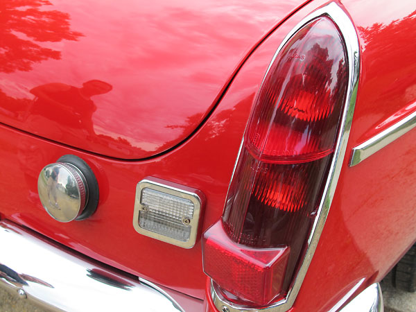 Early MGB taillights. Chromed covers on the backup lights are an accessory.