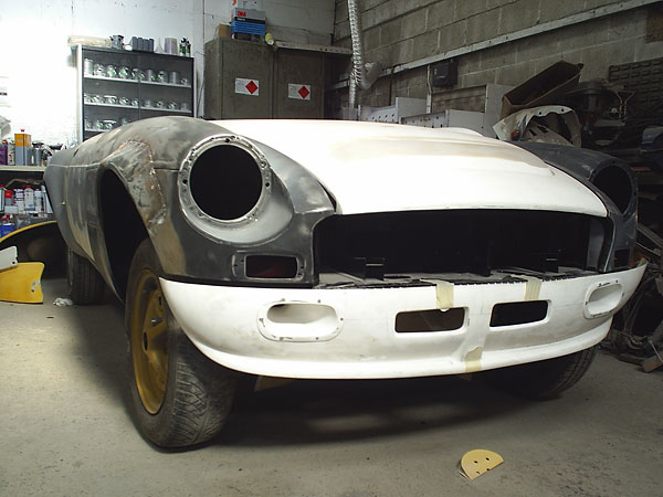 Steel front fenders with fabricated steel flares.