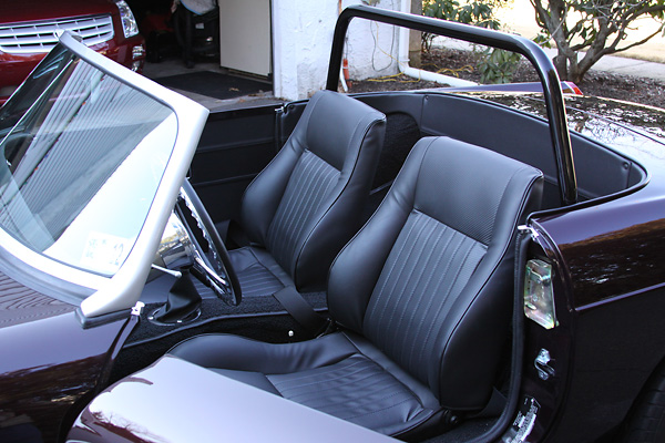 Entirely custom interior, featuring Pontiac Fiero seats with headrests removed.