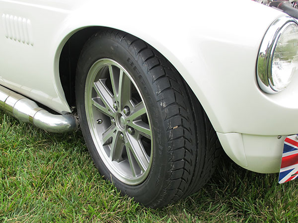 VW Rabbit fender flares, mounted on MGB fender and extended onto the apron.