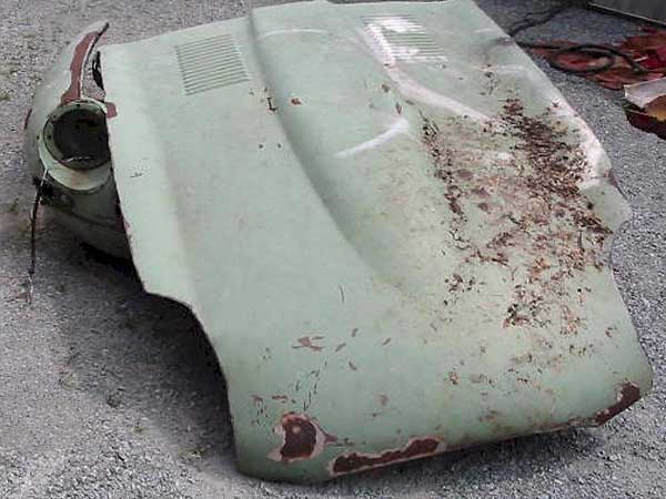 damaged Jaguar E-Type hood