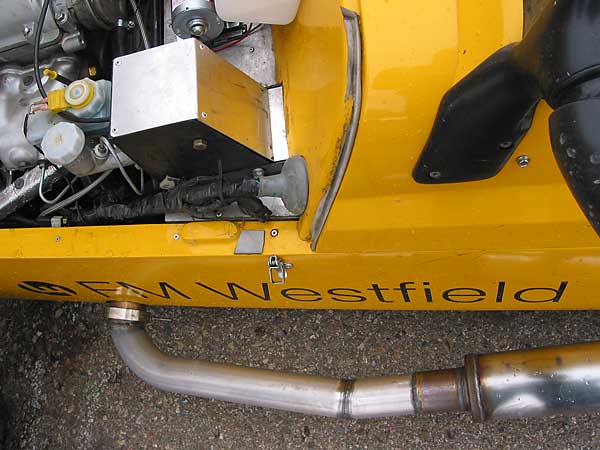Custom fabricated exhaust downpipe... notice the V-band attachment.