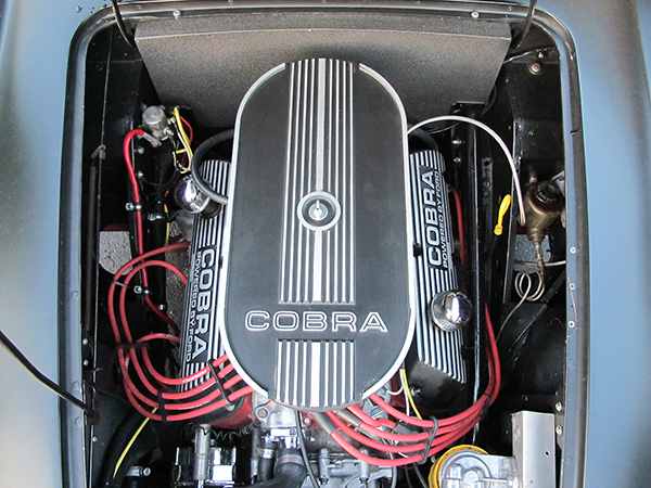 Ford 302 High Output engine from a 1985 Mustang Cobra, rated 235 HP stock.