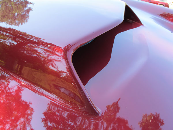 Note how the profile of the hood scoop's leading edge has been echoed in the surface below.