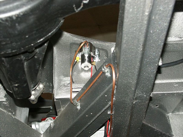 Electric operated line lock solenoid (in lieu of a cable-operated parking brake).