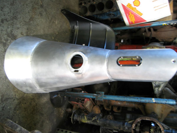 Custom fabricated one-piece stainless steel transmission and driveshaft tunnel.