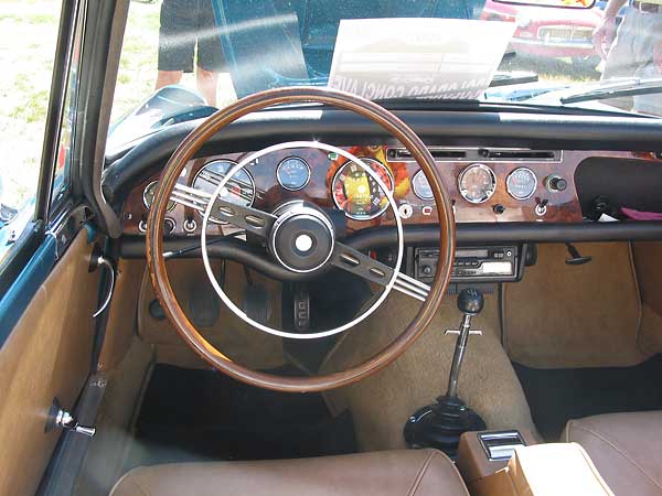 dashboard, steering wheel, and four speed shifter