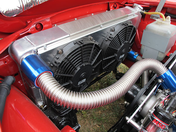 Griffin radiator mounted in U-brackets over the frame rails.