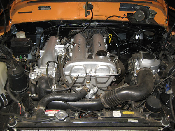 Stock 1992 Mazda 1.6L DOHC fuel-injected four cylinder engine.