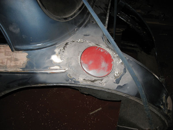 Mazda Miata recessed fuel filler cap.