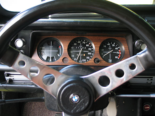 BMW 2002 steering wheel and instrument cluster. Speedo reads to 120mph. Tach reads to 8000rpm.