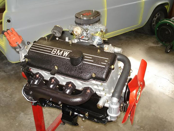 BMW 2002 engine upgraded with higher performance 2002Tii distributor and exhaust manifold.