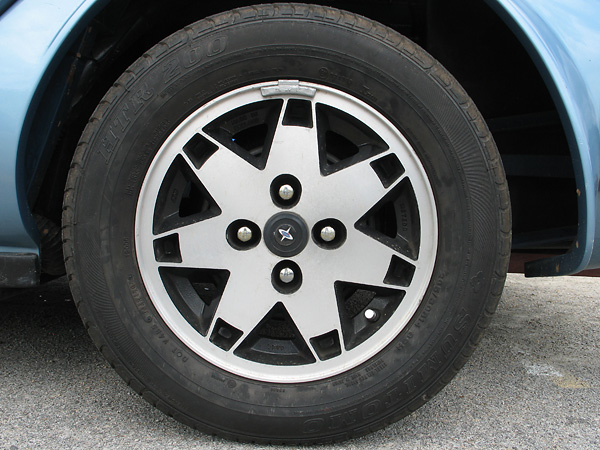 Marcos 14x6 Meteor wheels, wearing Sumitomo ETR 200 205/60R14 tires.