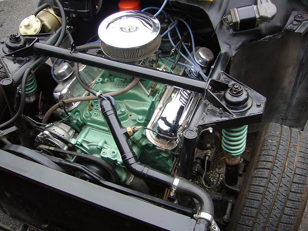 Chrysler 340 inlet manifold. Holley 600cfm carburetor.