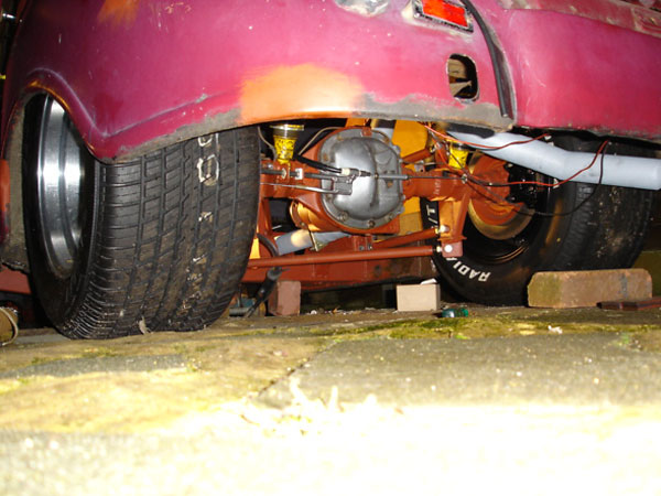 A Panhard rod keeps the rear suspension centered under the car.
