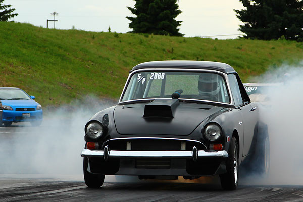 Custom front spoiler and hood scoop.