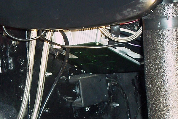 A screen protects the ECU and wiring.
