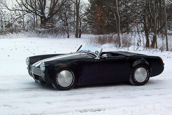 The windshield has been chopped 4.5 inches, and the top trim has been removed.