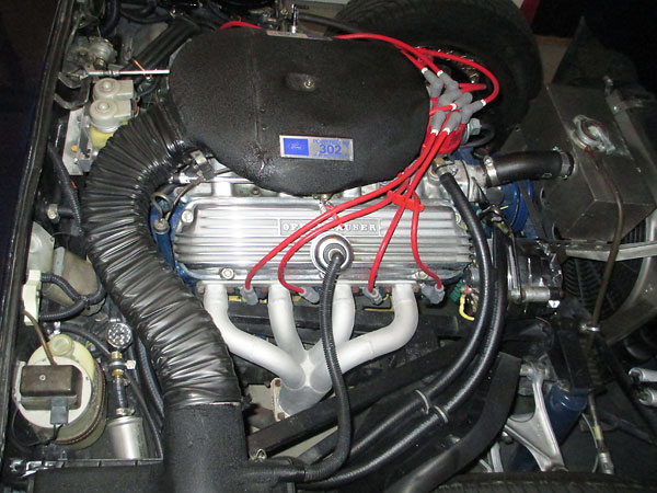 Offenhauser 360 intake manifold and Edelbrock 500cfm four barrel carburetor.