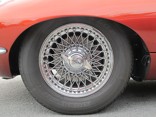 Stock Jaguar 72-spoke wire wheels.