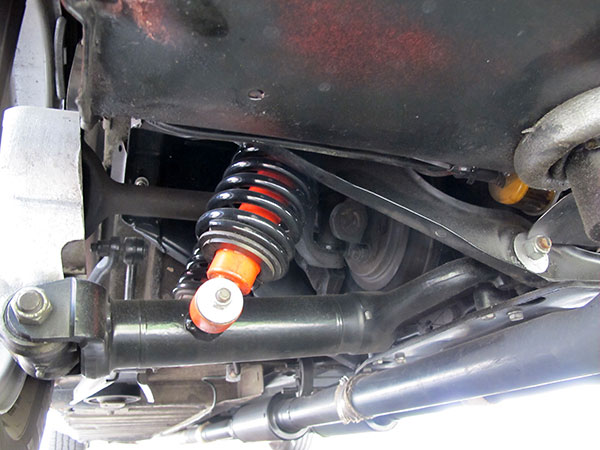 Stock Jaguar rear suspension. Note dual coilover shock absorbers per side.