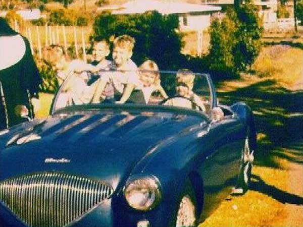 After V8 install, but before the body mods of 1964. (Note the original grille)