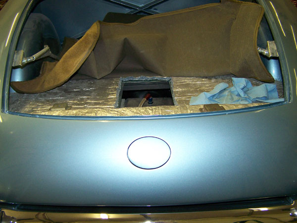 Trunk insulation, and access hole for fuel tank connections.