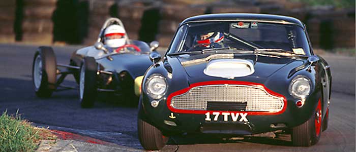 Jim Freeman's DB4GT leading Christian Morici's Lotus 18 through Summit Point Raceway's carousel