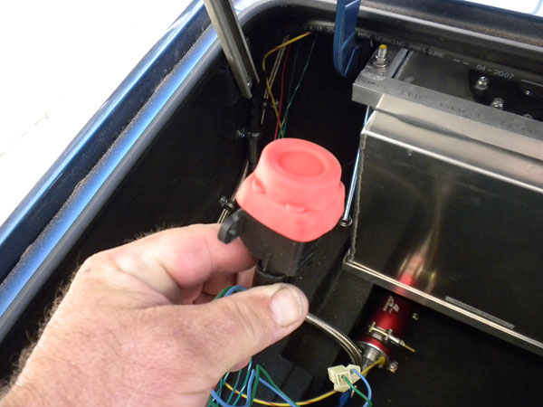 In the event of an accident, this inertia switch would shut-off the high volume fuel pump.