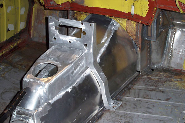 Custom fabricated aluminum Triumph TR6 transmission cover and center console.