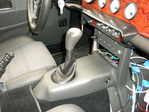 Switches on the side surface of the center console are for electric seat heaters.