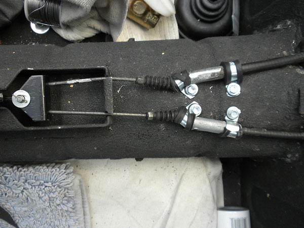 Nissan 240SX parking brake cables, connected to the Triumph TR6 lever and bracketry.