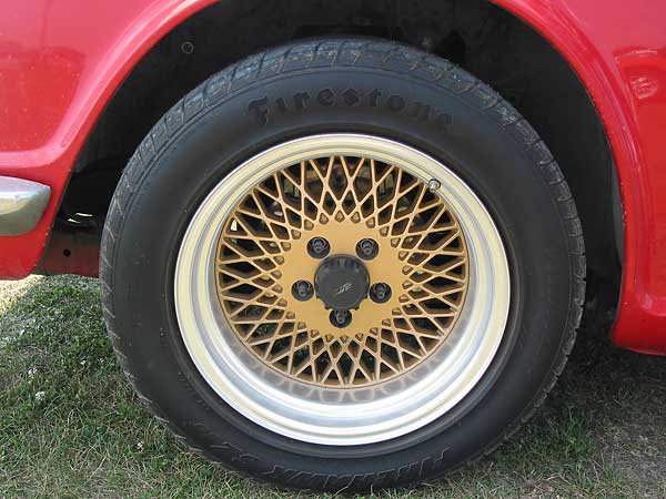 Enki wheels and Firestone Firehawk tires.