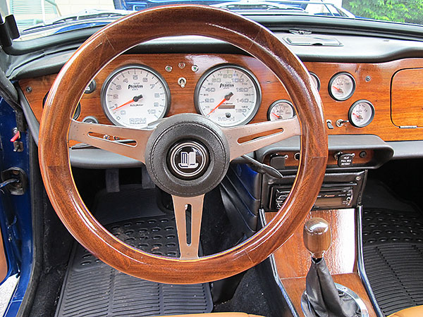 Custom walnut and oak steering wheel rim on original steering wheel ring.