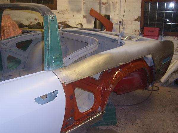 Installing new rear fenders on a Triumph Stag.