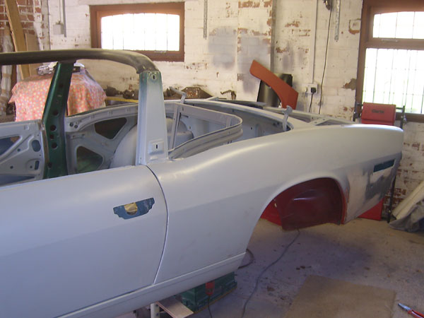 After carefully smoothing the fenders, Gary left original chrome side trim off.