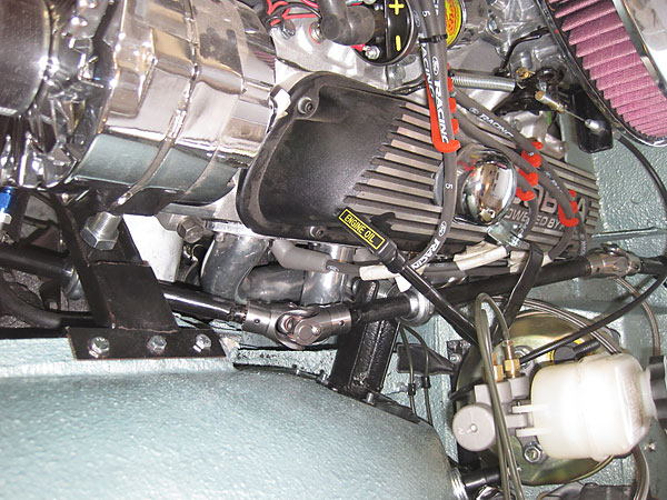 Woodward steering shaft with three u-joints and two Heim joints for support.