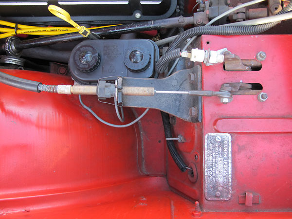 The cable connects to the pedal via the original lever for the clutch master cylinder.