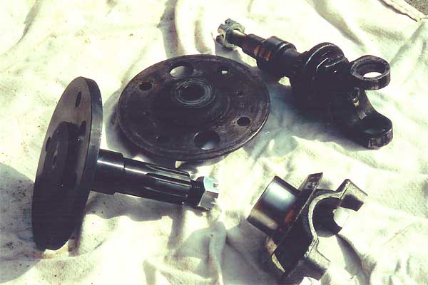 Comparing the Summers Brothers stub axle (left) with the old TR-6 stub axle and flange.