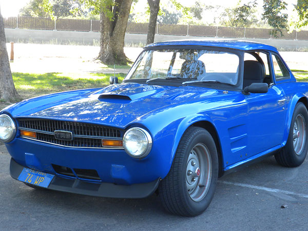 Stock Triumph TR6 wheels.