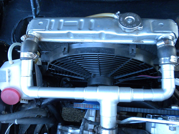 Modified stock radiator, with dual intake and outlet ports and a 4-row core.