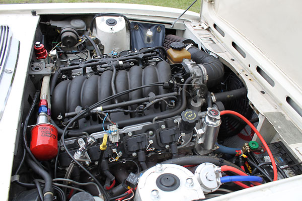 Chevrolet LS1 5.7L with electronic fuel injection. Stock intake manifold, plenum, and throttle body.