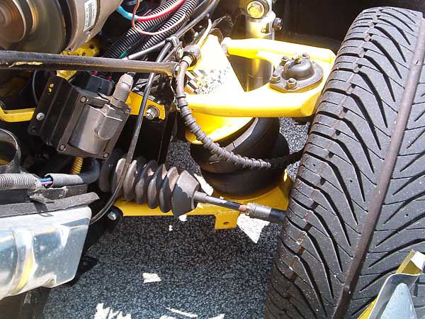 Custom air-ride suspension: Home-made A-arms and Mustang II spindles.