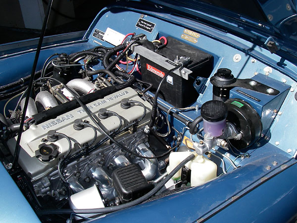 Nissan 240SX 2.4L DOHC engine with electronic fuel injection.