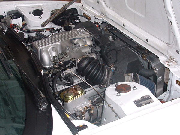 Aluminum radiator is an off-the-shelf item, made to fit a Nissan Skyline (turbo/R33).